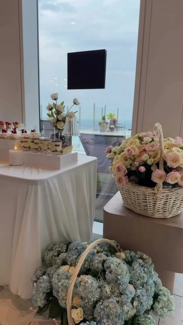 Rooftop pool birthday dessert setup with hydrangeas