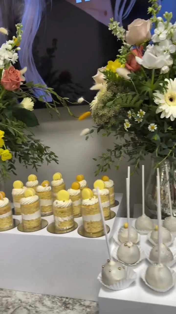 Dessert table with garden florals and cake pops at a med spa