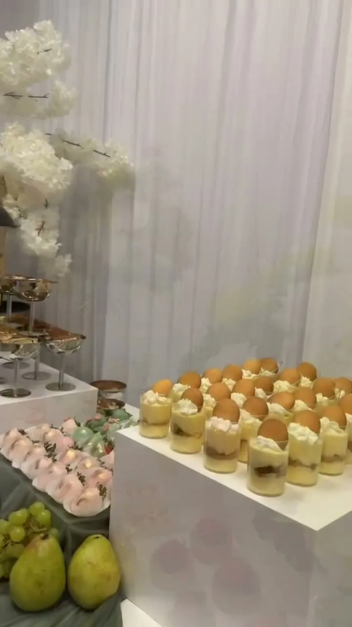 Strawberry cream cups beside green hydrangeas